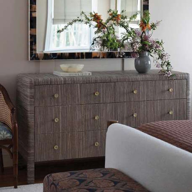 Grasscloth dresser and faux horn mirror produced by Thien Phat